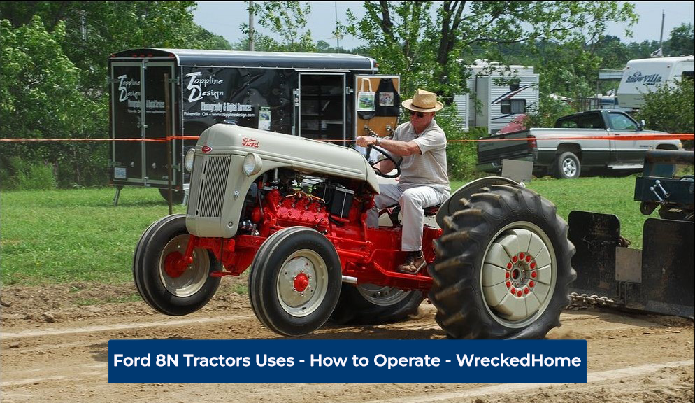 male farmer using his Ford 8N tractor to move his trailer