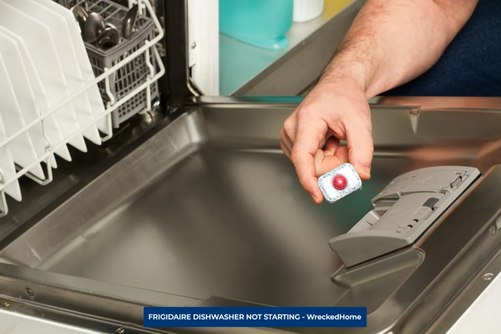 Man Adding Detergent to FRIGIDAIRE Dishwasher