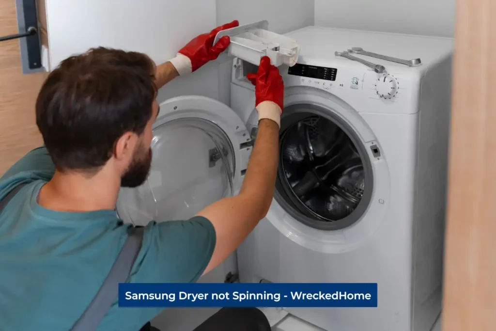 Worker fixing Samsung Dryer not Spinning