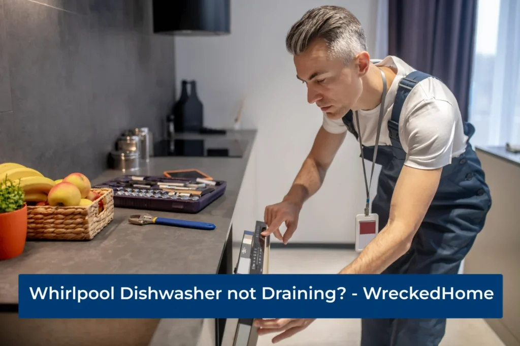 Man fixing Whirlpool Dishwasher not draining
