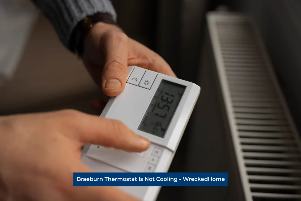 Man Turning on Braeburn Thermostat