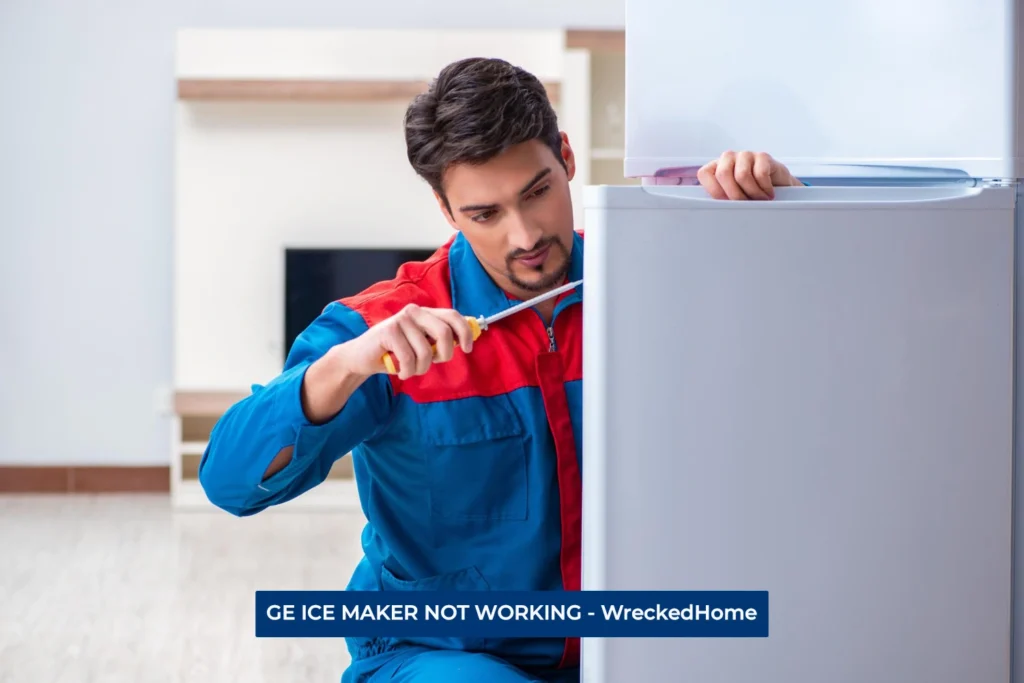 Worker fixing GE ICE Maker