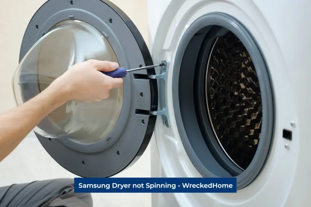 Worker fixing Samsung Dryer not Spinning
