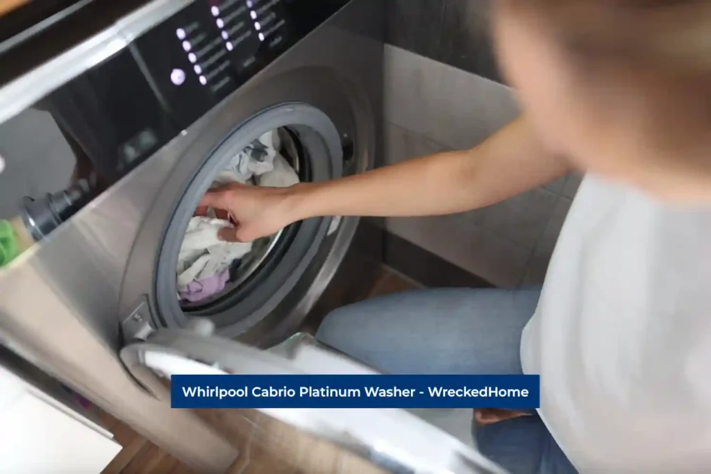 Women taking clothes out from Whirlpool Cabrio Platinum Washer