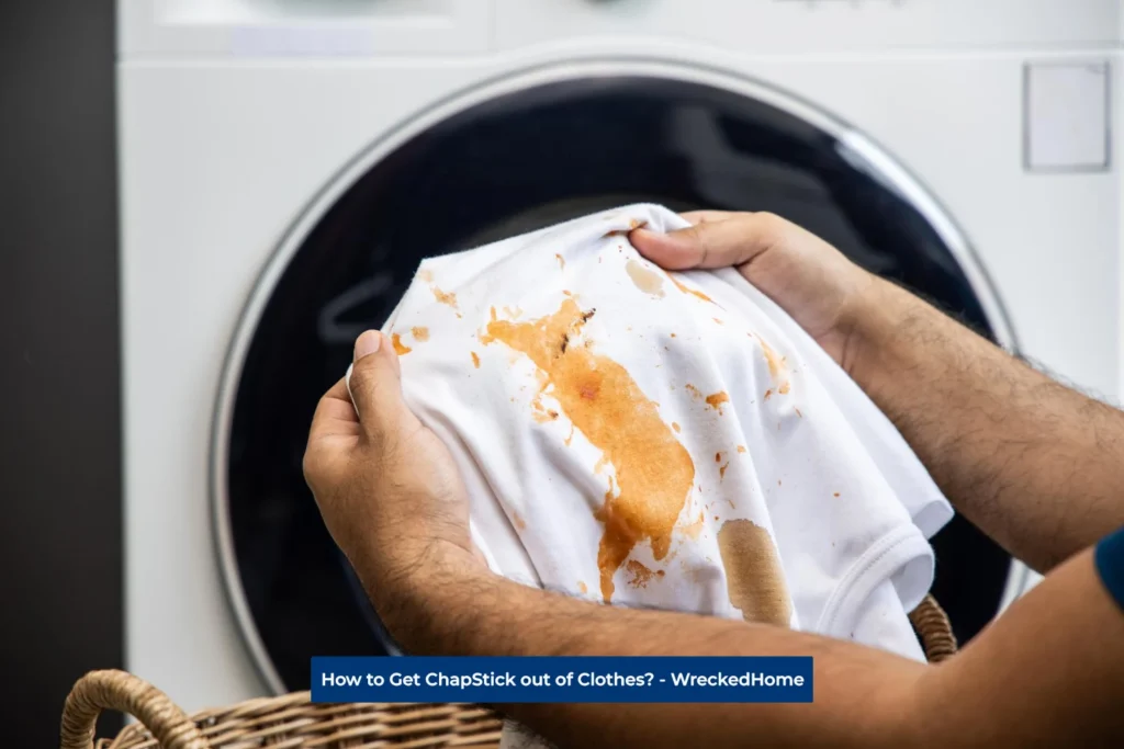 Man washing clothes stained with ChapStick
