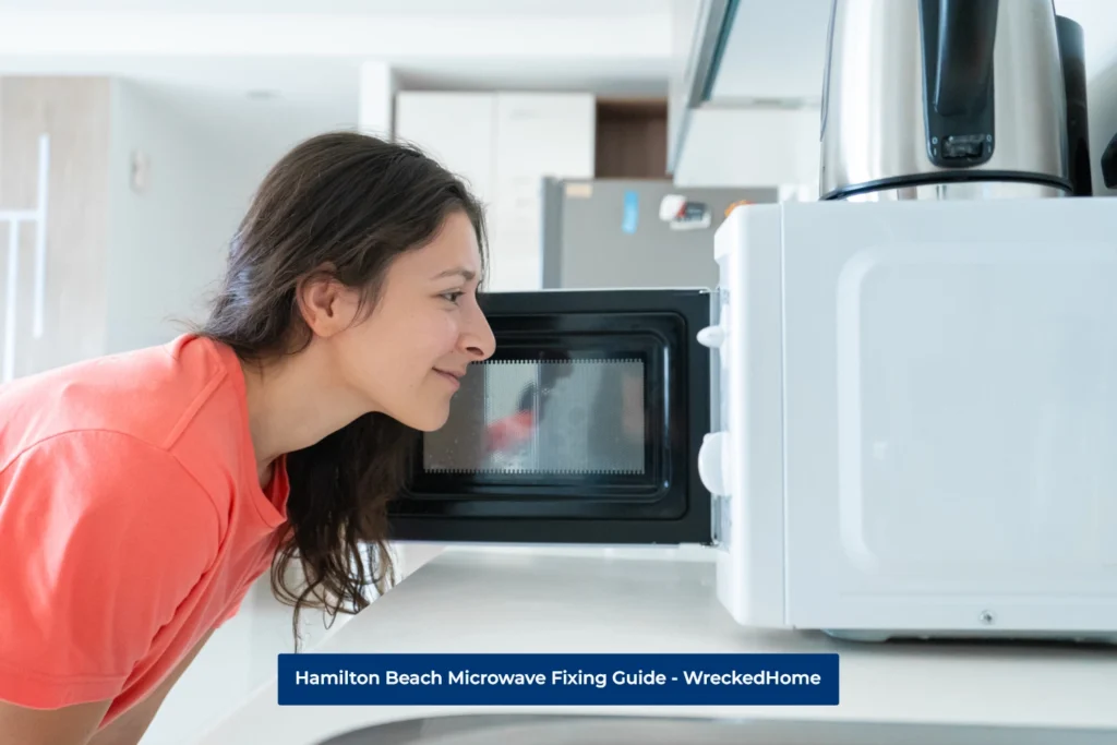 Woman Looking inside Hamilton Beach Microwave. in the Kitchen.