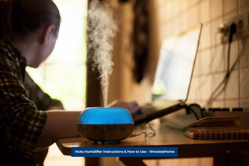 Woman working on her laptop with Vicks Humidifier by her Side