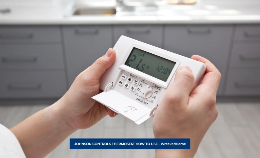 MAN ADJUSTING JOHNSON CONTROLS THERMOSTAT HOW TO USE.